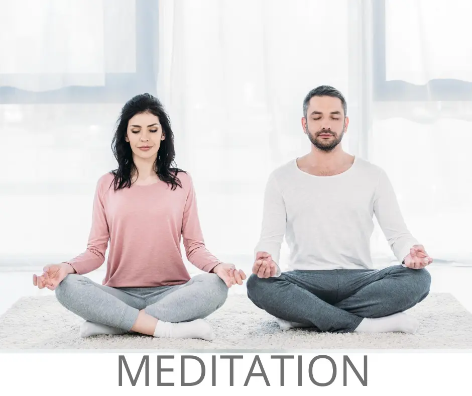 Man and woman practicing seated meditation indoors as part of a 3 to 7 day Ayurvedic purification program in Ottawa